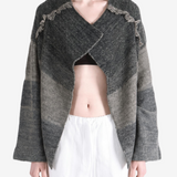 Grey hoodie worn by a person, showing the hoodie fit