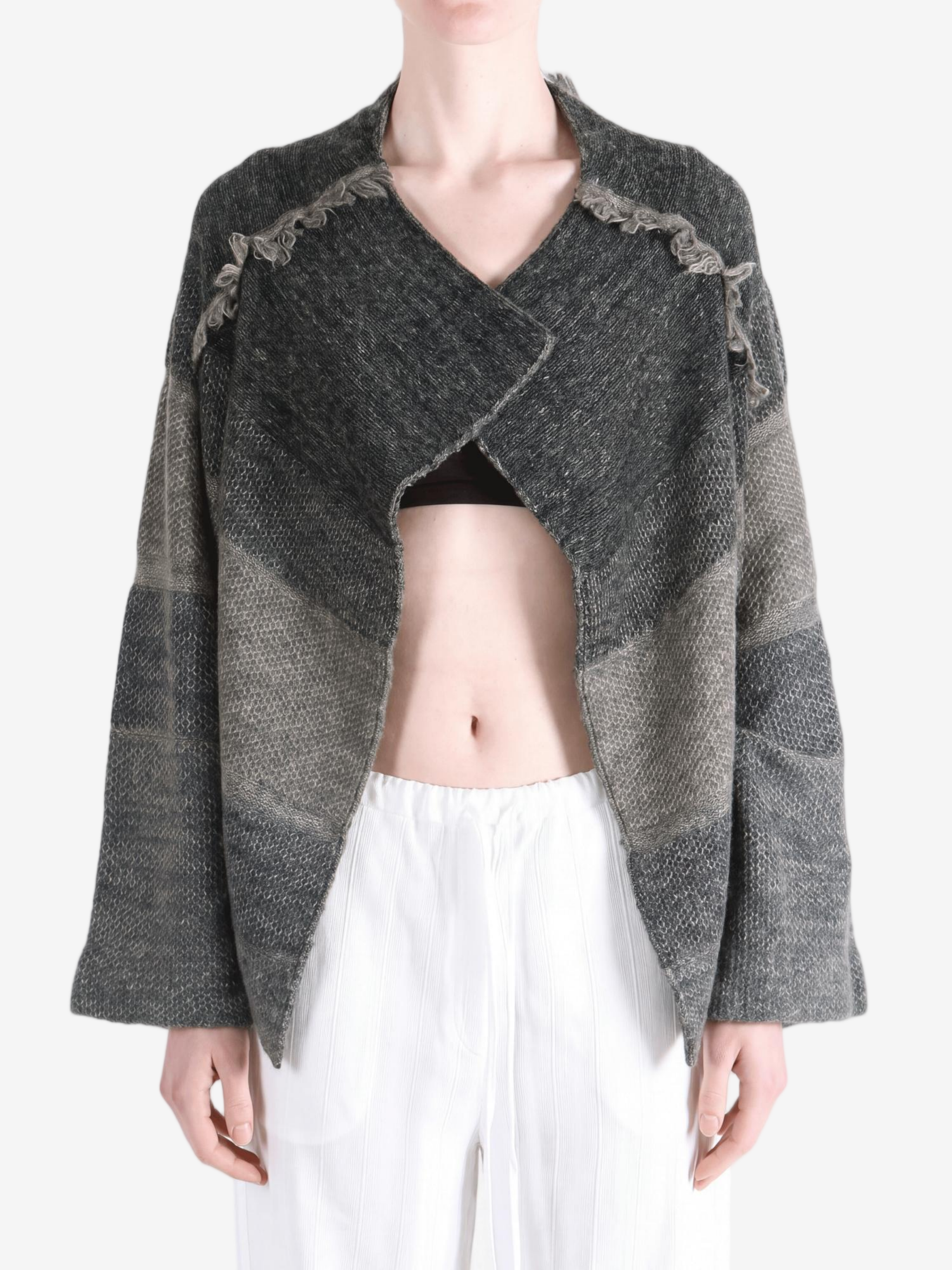 Grey hoodie worn by a person, showing the hoodie fit
