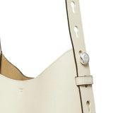 Close up of the white bag, showing texture of the leather fabric