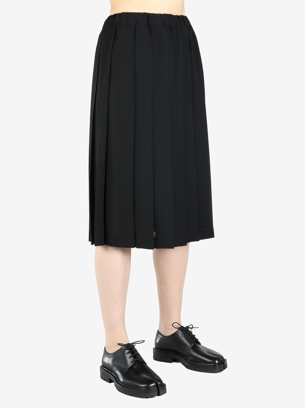 Black skirt worn by a person, showing the skirt's fit