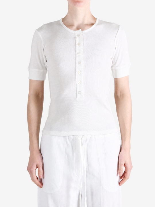 White top worn by a person, showing the top fit