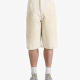 White shorts worn by a person, showing the shorts fit