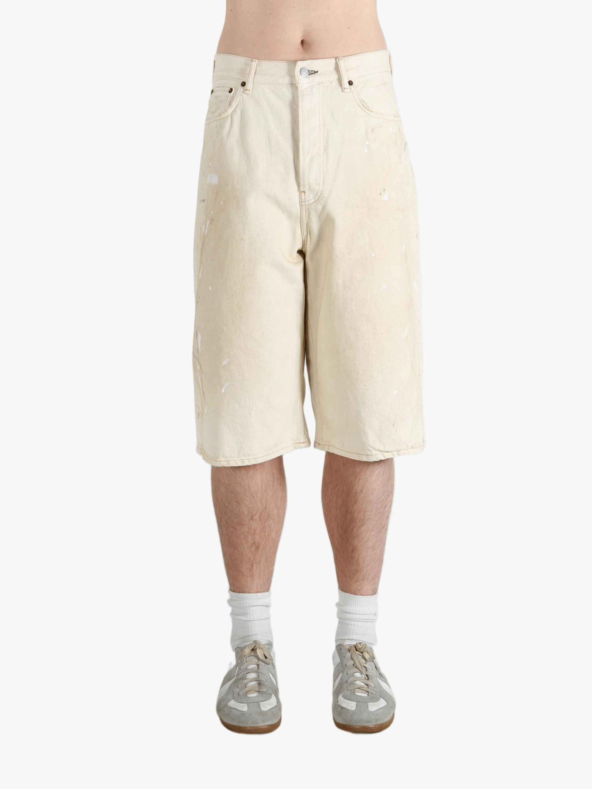 White shorts worn by a person, showing the shorts fit