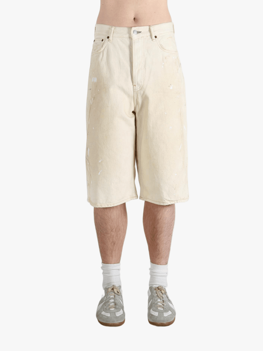 White shorts worn by a person, showing the shorts fit