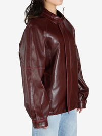 Burgundy jacket worn by a person, showing the jacket's fit