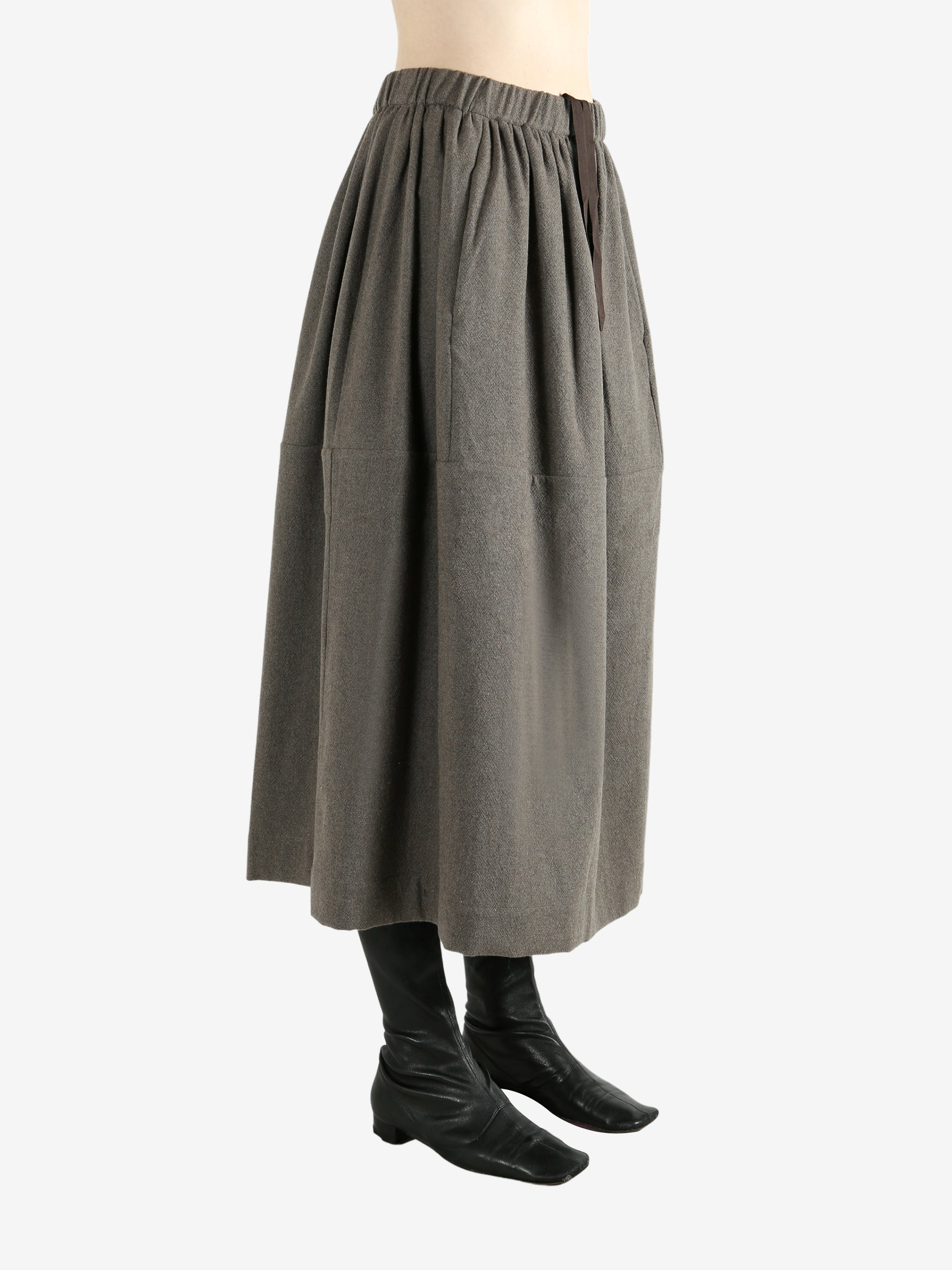 Grey skirt worn by a person, showing the skirt fit