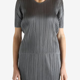 Grey shirts worn by a person, showing the shirts fit