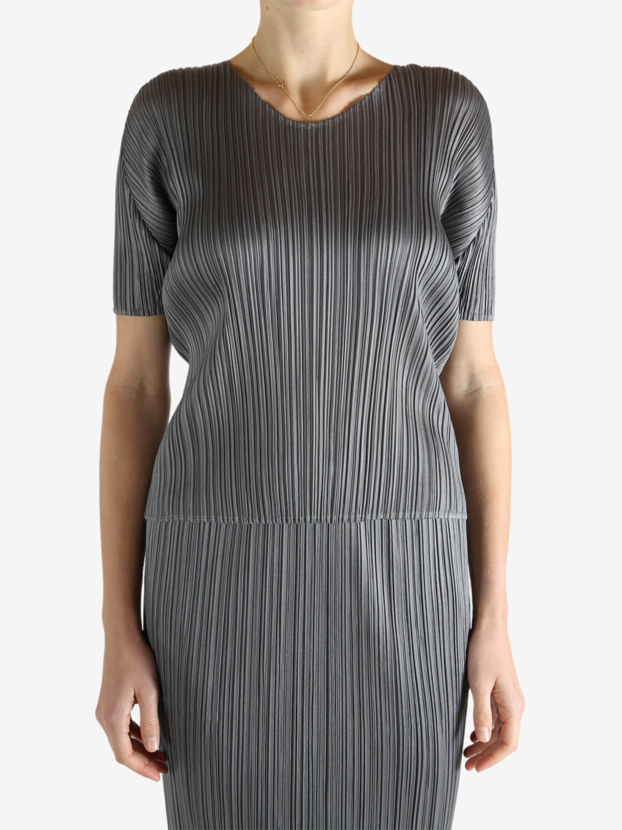 Grey shirts worn by a person, showing the shirts fit