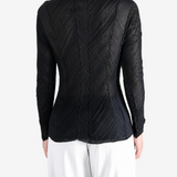 Black shirt worn by a person, showing the shirt fit