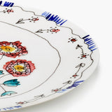 Close up of blue plate, showing texture of the bone porcelain fabric