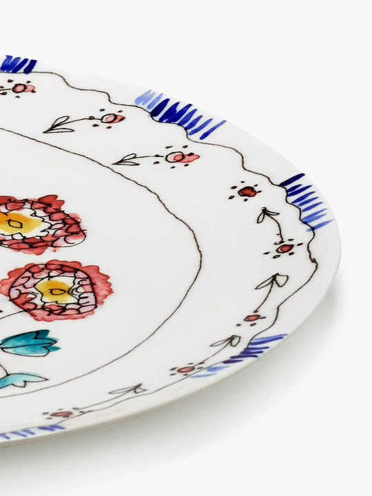 Close up of blue plate, showing texture of the bone porcelain fabric