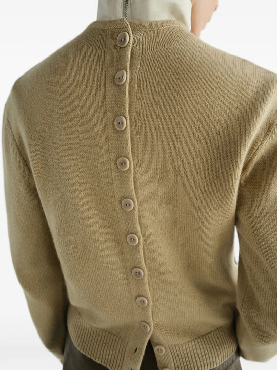 Tan hoodie worn by a person, showing the hoodie fit