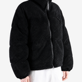 Black jacket worn by a person, showing the jacket fit