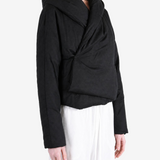 Black jacket worn by a person, showing the jacket fit