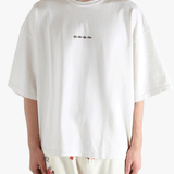 White shirt worn by a person, showing the shirt's fit