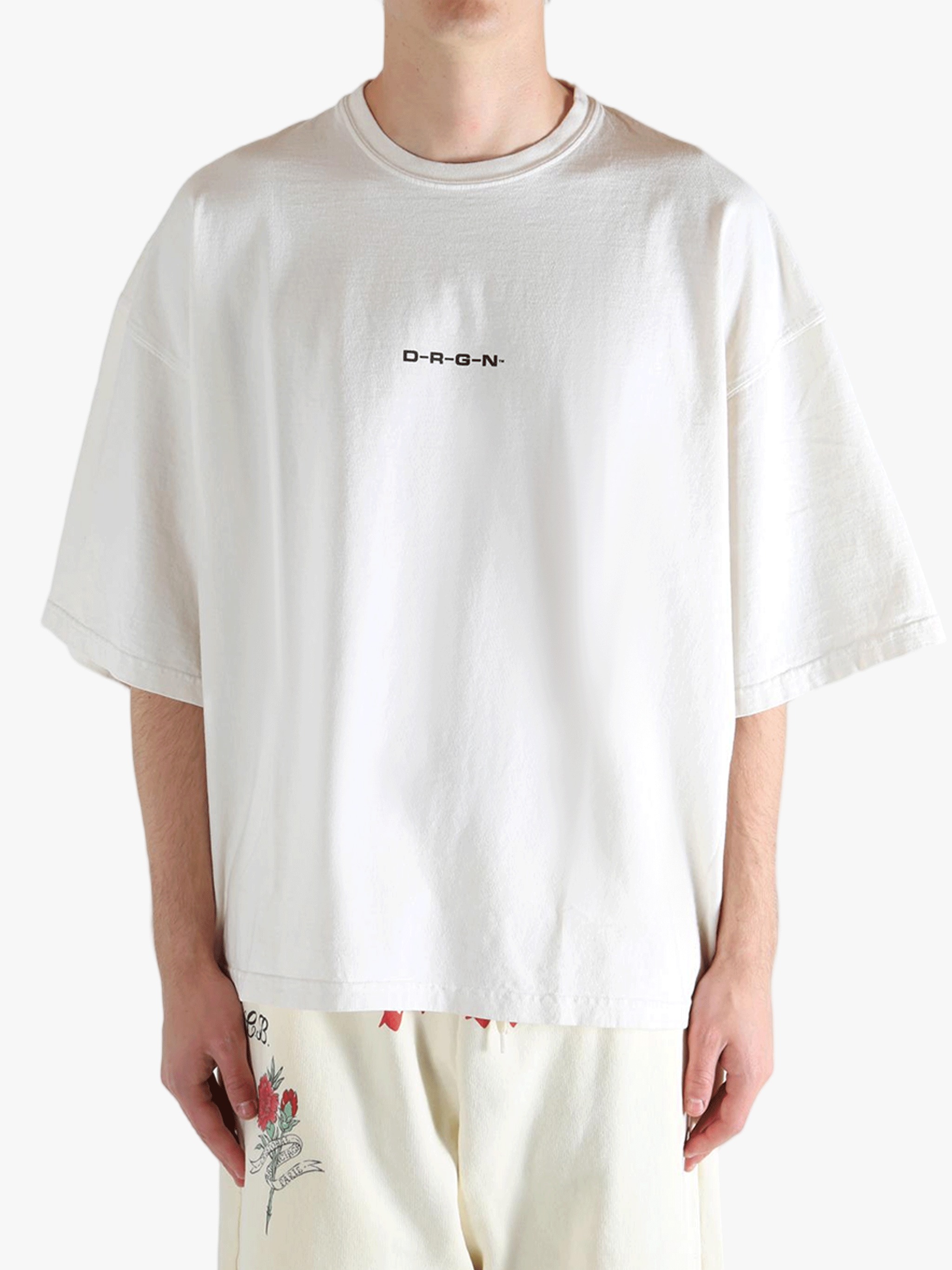 White shirt worn by a person, showing the shirt's fit