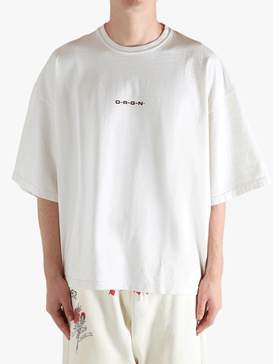 White shirt worn by a person, showing the shirt's fit