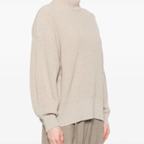 Tan knitwears worn by a person, showing the knitwears fit