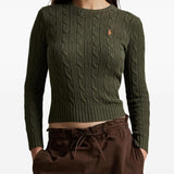 Green pullover worn by a person, showing the pullover's fit