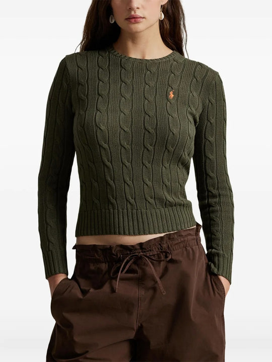 Green pullover worn by a person, showing the pullover's fit