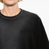 Close up of Black T-shirts, showing texture of the cotton fabric
