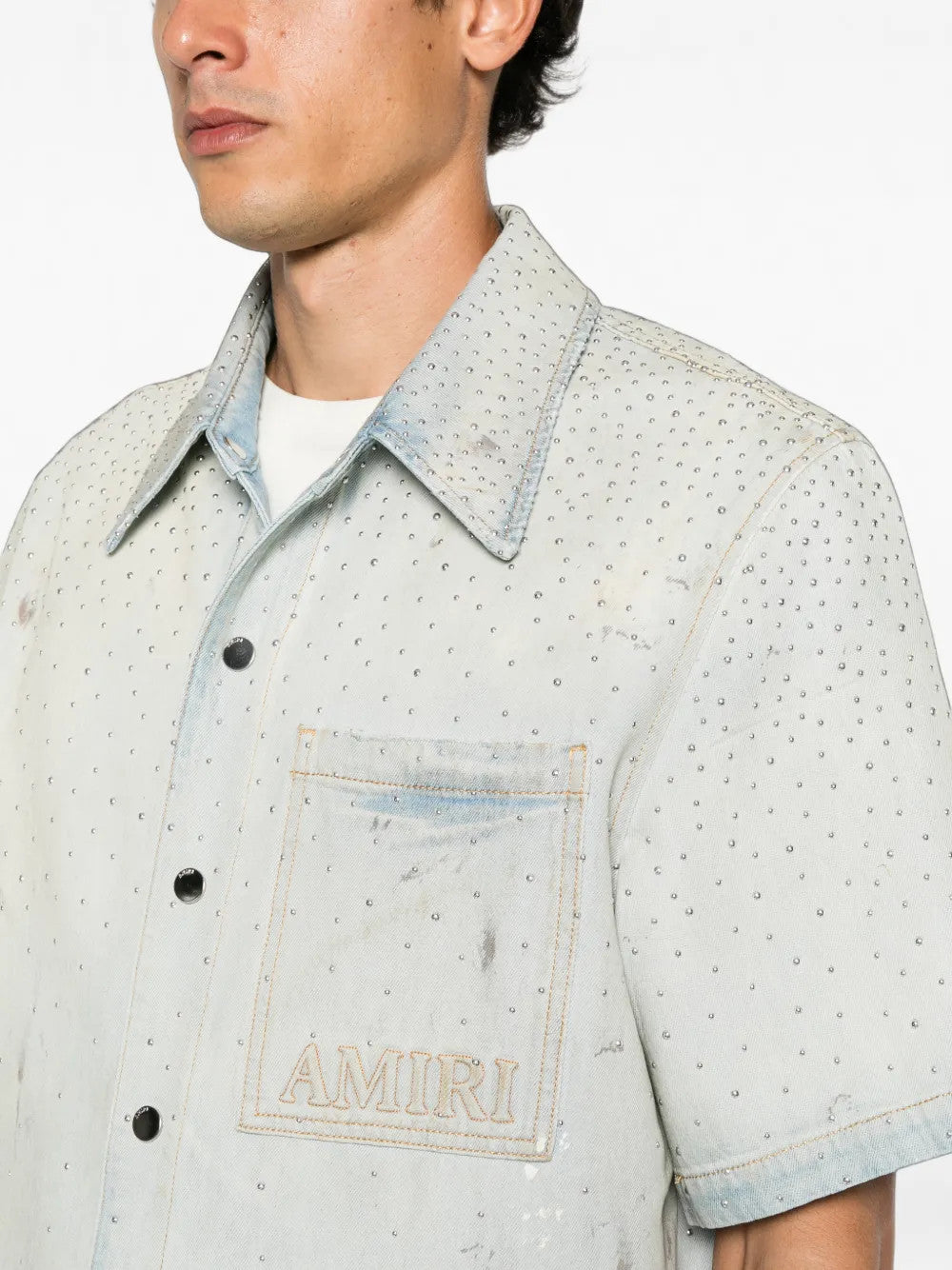 Blue shirt worn by a person, showing the shirt fit