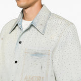 Blue shirt worn by a person, showing the shirt fit