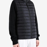 Black jacket worn by a person, showing the jacket fit
