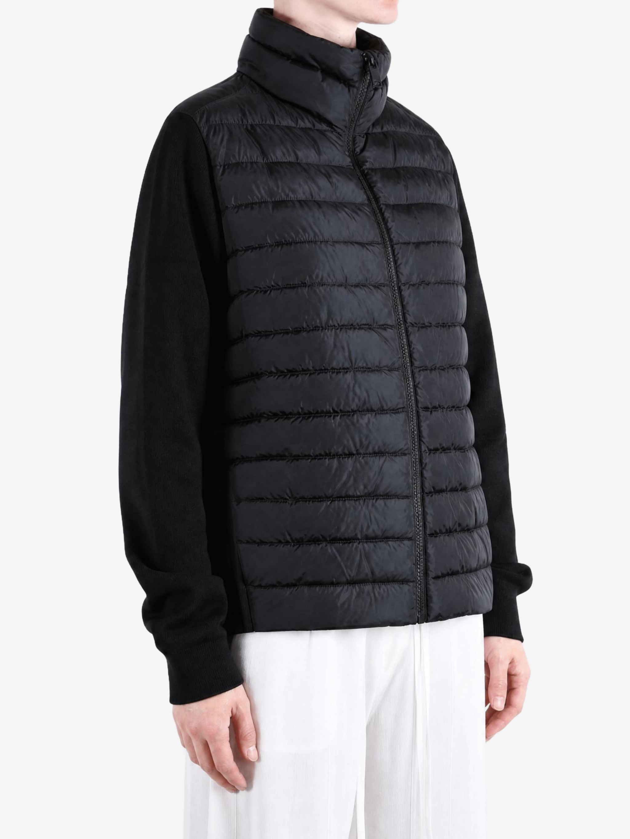Black jacket worn by a person, showing the jacket fit