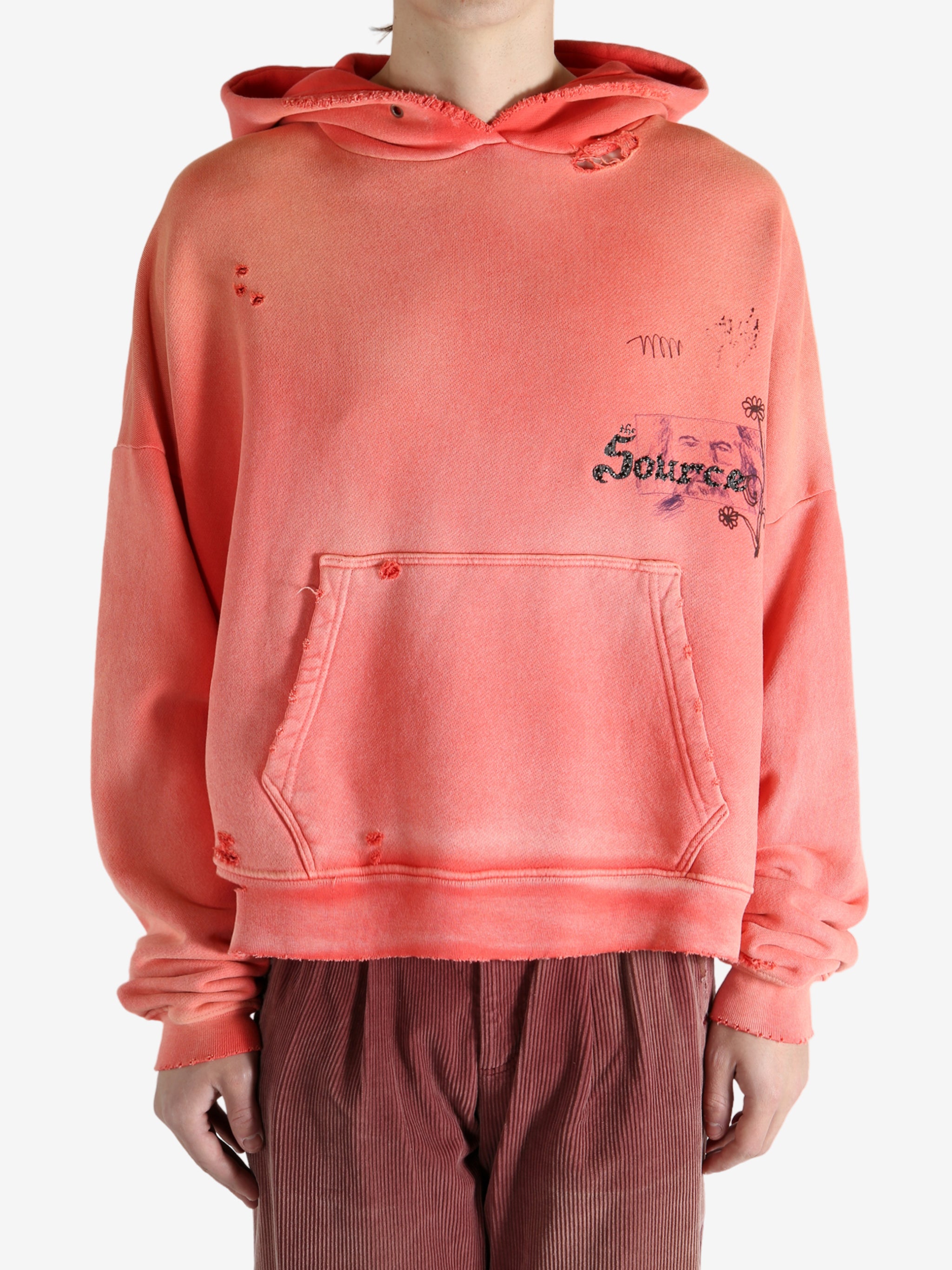 Red hoodie worn by a person, showing the hoodie fit