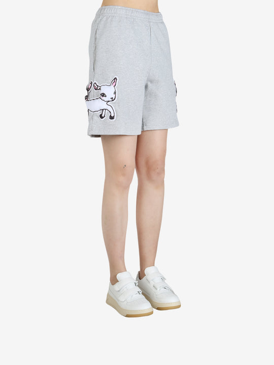 Grey pants worn by a person, showing the pants' fit