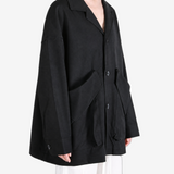Black jacket worn by a person, showing the jacket fit
