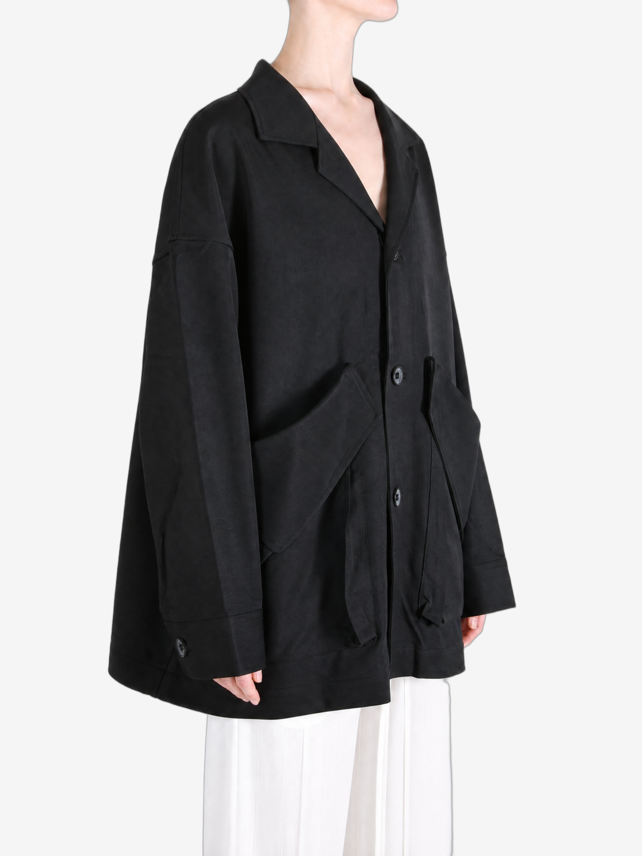 Black jacket worn by a person, showing the jacket fit