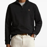 Black knitwear worn by a person, showing the knitwear fit