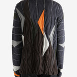 Brown top worn by a person, showing the top's fit