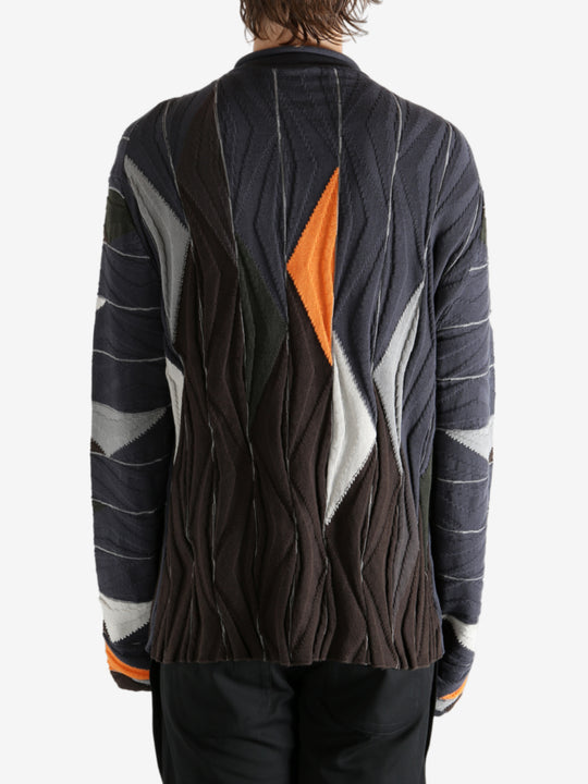 Brown top worn by a person, showing the top's fit