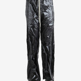 Black pants worn by a person, showing the pants' fit