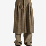 Brown pants worn by a person, showing the pants' fit