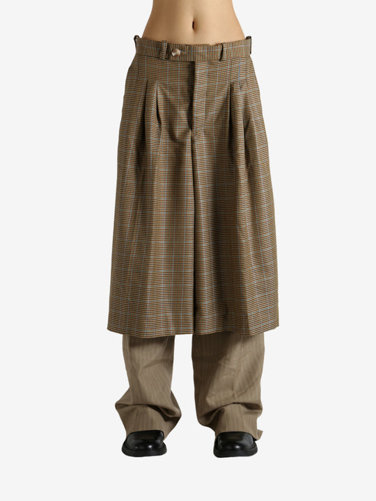 Brown pants worn by a person, showing the pants' fit