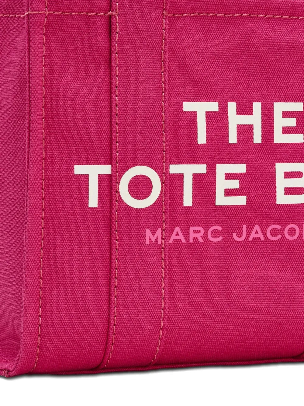 Close up of pink bag, showing brand logo