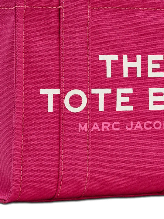 Close up of pink bag, showing brand logo