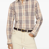 Tan shirts worn by a person, showing the shirts fit