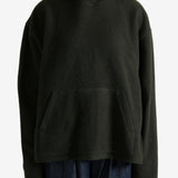 Green hoodie worn by a person, showing the hoodie's fit