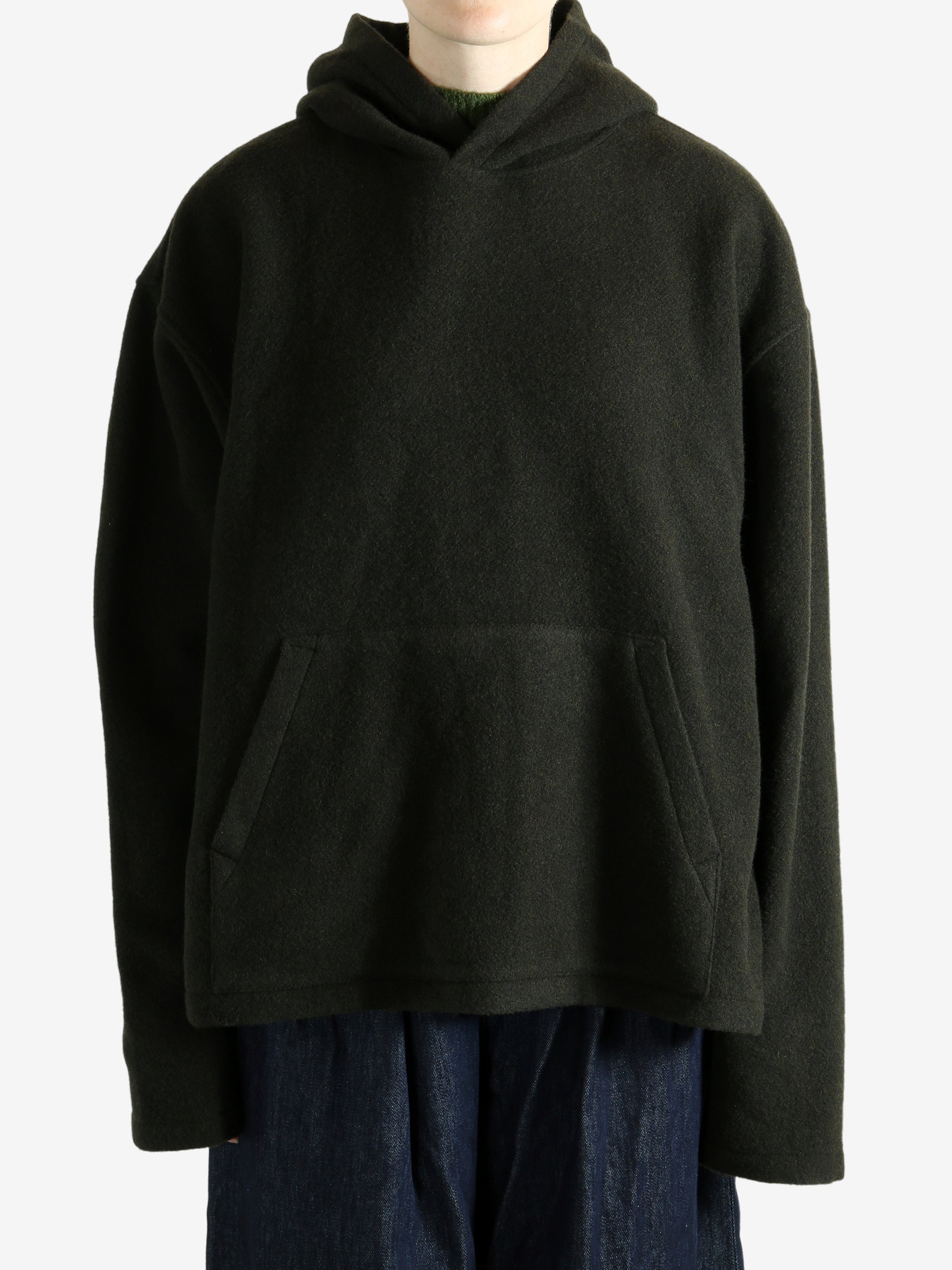 Green hoodie worn by a person, showing the hoodie's fit