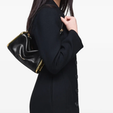 Black bag worn by a person, showing the bag fit