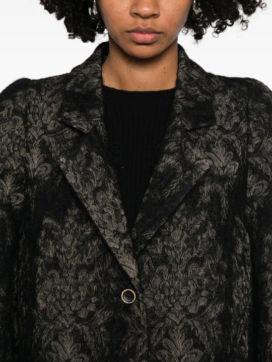 Close up of black jackets, showing texture of the fabric