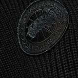 Close up of the black hoodie, showing texture of the polyamide fabric