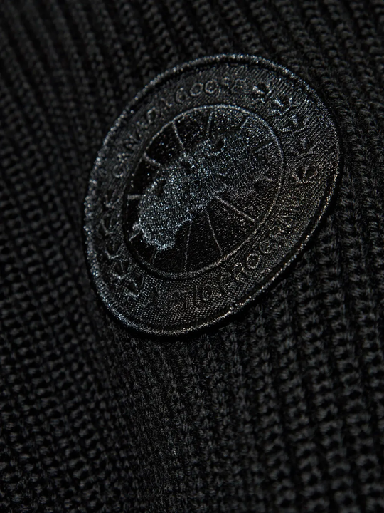 Close up of the black hoodie, showing texture of the polyamide fabric