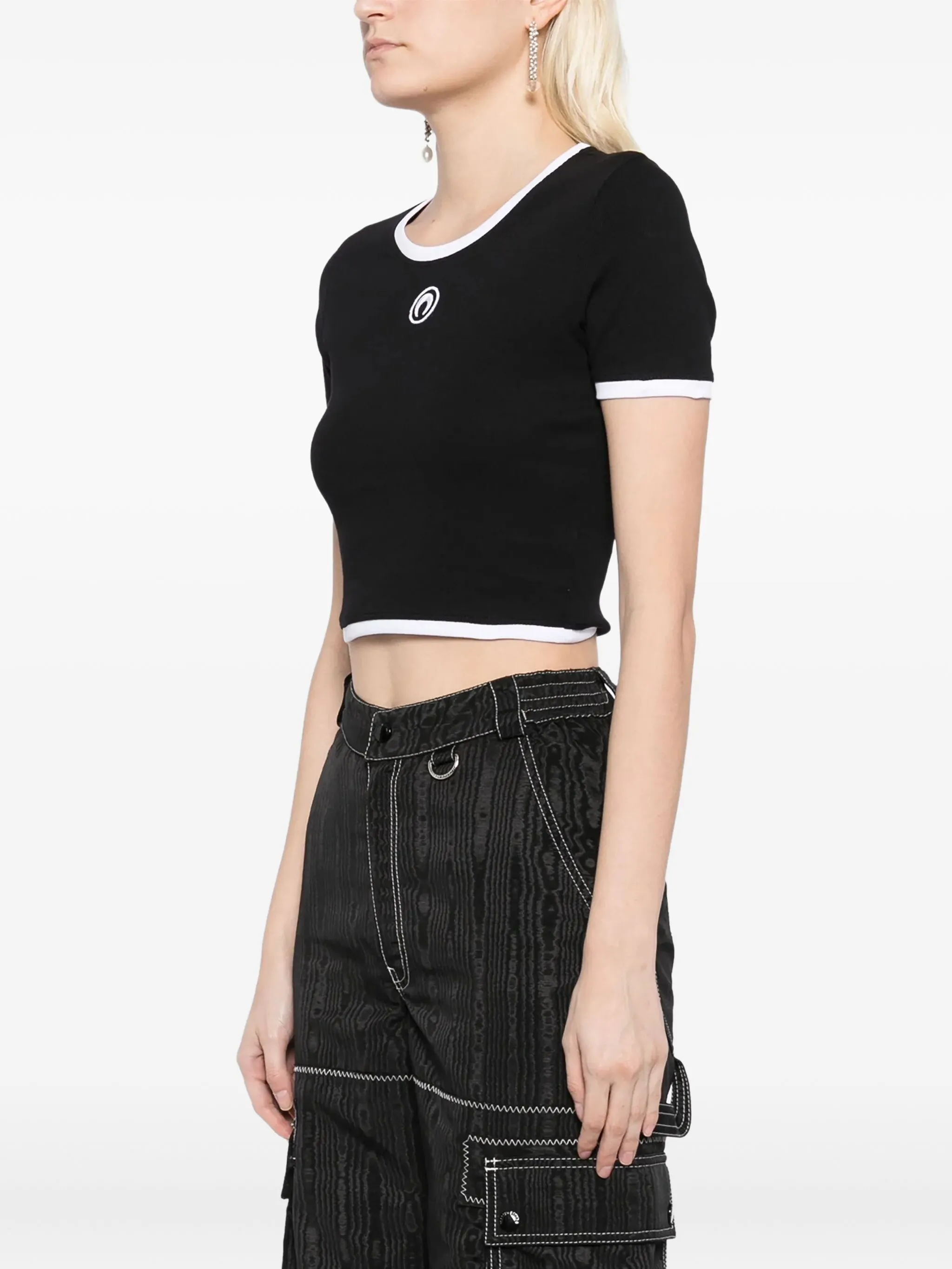 black top worn by a person, showing the top  fit
