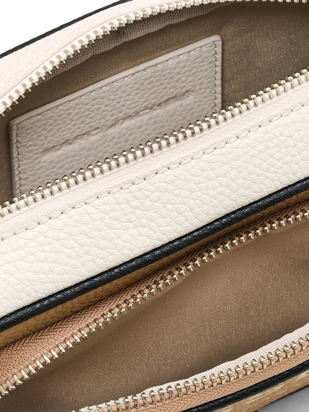 Close up of tan bags, showing texture of the split cow leather and polyurethane coating fabric